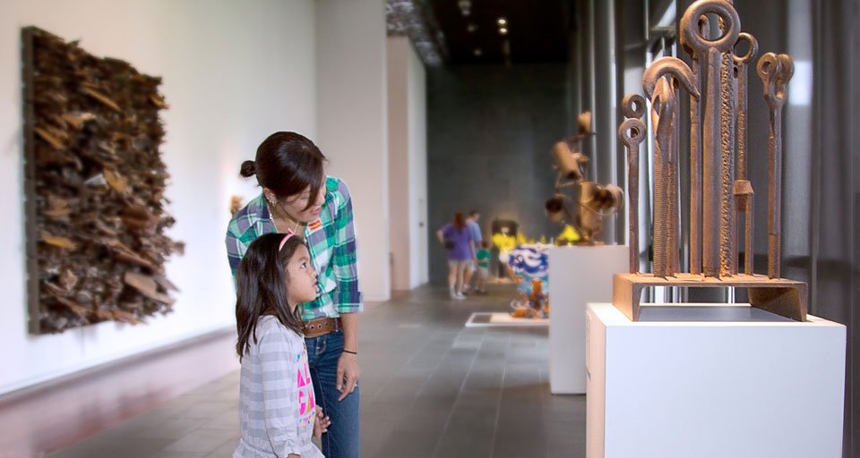 Woman and child viewing art