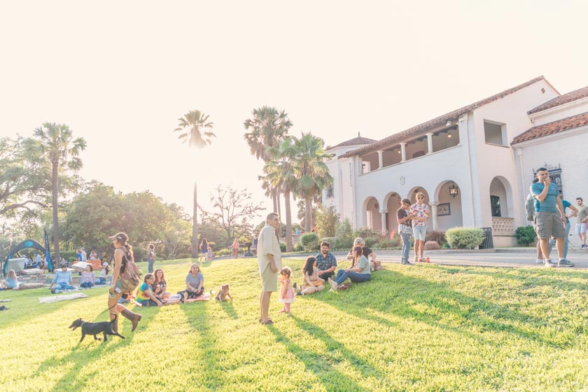 McNay visitors sitting on lawn